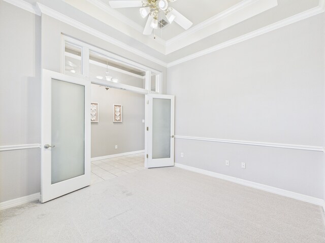 1197 Pleasant Oaks Dr, Lewisville, TX 75067 - unfurnished bedroom featuring carpet floors, a raised ceiling, crown molding, french doors, and a ceiling fan