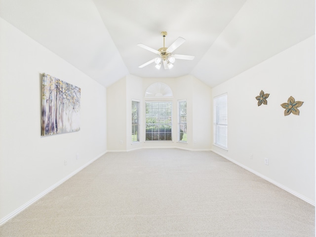1197 Pleasant Oaks Dr, Lewisville, TX 75067 - empty room with vaulted ceiling, light colored carpet, and ceiling fan