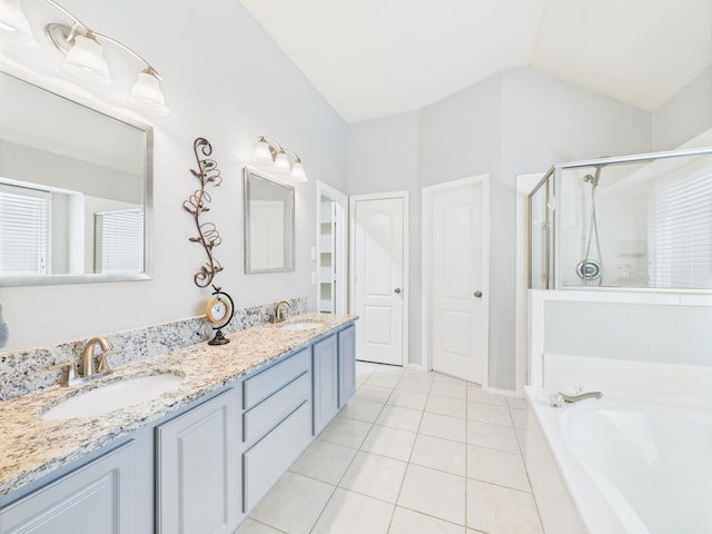1197 Pleasant Oaks Dr, Lewisville, TX 75067 - full bath with tile patterned floors, a stall shower, double vanity, a garden tub, and lofted ceiling