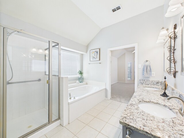 1197 Pleasant Oaks Dr, Lewisville, TX 75067 - full bathroom featuring lofted ceiling, tile patterned flooring, a stall shower, a garden tub, and double vanity