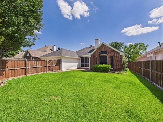 1197 Pleasant Oaks Dr, Lewisville, TX 75067 - rear view of property featuring brick siding, a fenced backyard, and a chimney