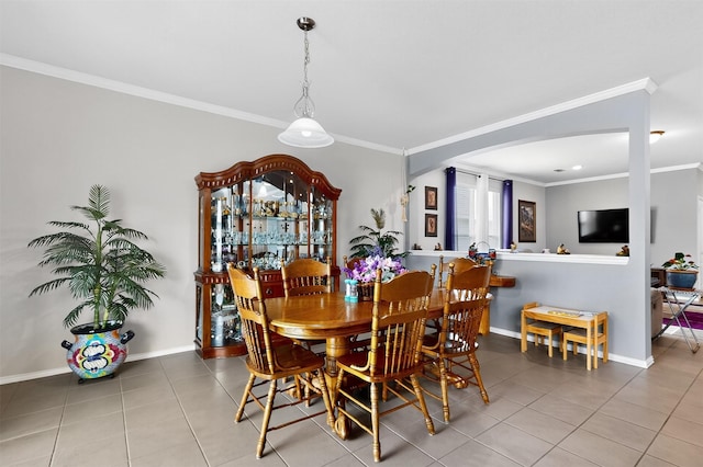 1712 Intervale Rd, Providence Village, TX 76227 - dining space with tile patterned flooring, ornamental molding, and arched walkways