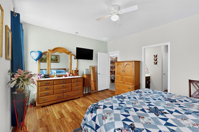 1712 Intervale Rd, Providence Village, TX 76227 - bedroom with light wood-type flooring, a walk in closet, ceiling fan, a closet, and ensuite bathroom