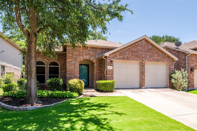 109 Niagara Falls Dr, Anna, TX 75409 - view of front of house with an attached garage, brick siding, concrete driveway, and a front yard