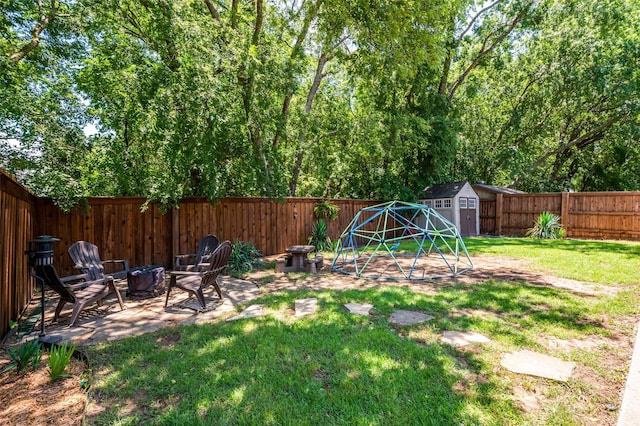 109 Niagara Falls Dr, Anna, TX 75409 - fenced backyard with a storage unit, an outdoor fire pit, and a patio