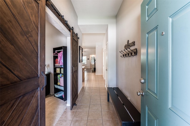 109 Niagara Falls Dr, Anna, TX 75409 - hall featuring a barn door and light tile patterned floors