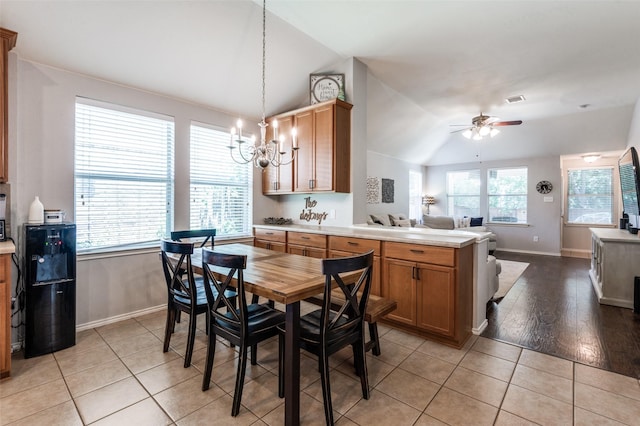 109 Niagara Falls Dr, Anna, TX 75409 - dining area with lofted ceiling, ceiling fan, a chandelier, and light tile patterned floors