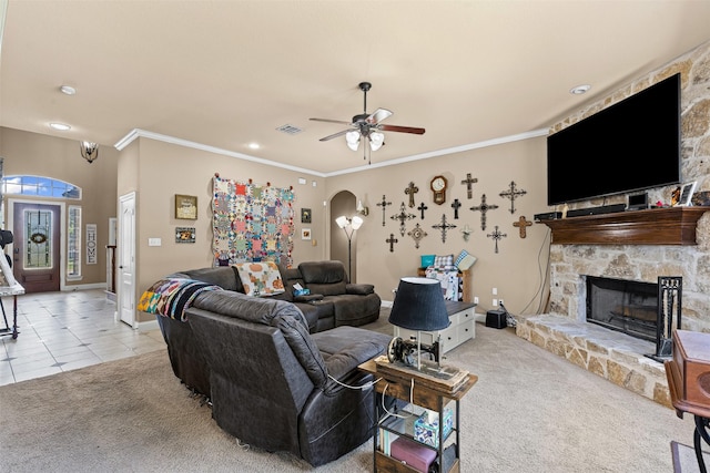 5024 Running Brook Dr, Joshua, TX 76058 - living room with carpet, ceiling fan, ornamental molding, a stone fireplace, and arched walkways