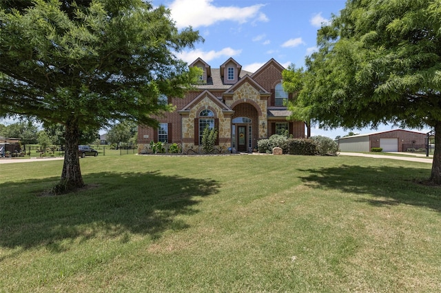 5024 Running Brook Dr, Joshua, TX 76058 - traditional-style house with stone siding and a front yard