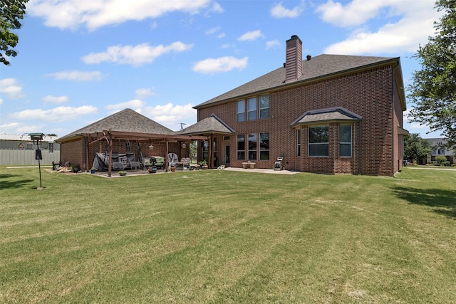 5024 Running Brook Dr, Joshua, TX 76058 - back of property featuring a chimney, brick siding, a patio area, and a lawn