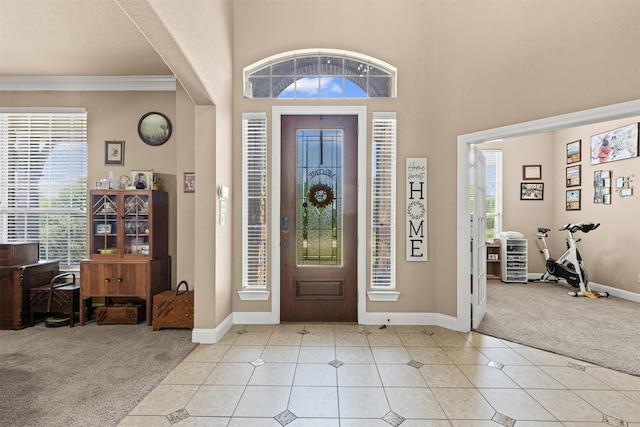 5024 Running Brook Dr, Joshua, TX 76058 - entrance foyer with light colored carpet, light tile patterned floors, crown molding, and a towering ceiling