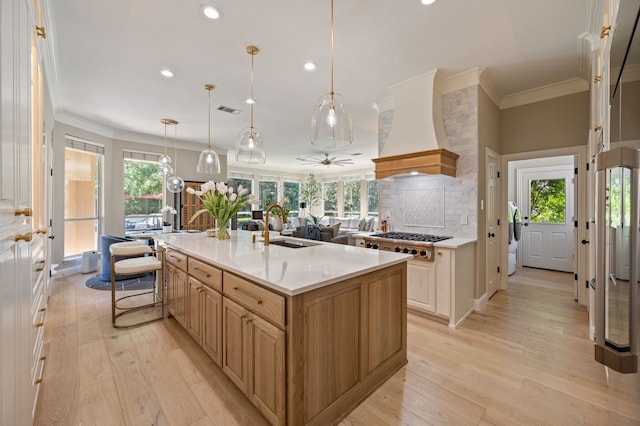 1001 Lakeridge Ct, Colleyville, TX 76034 - kitchen featuring premium range hood, stainless steel gas cooktop, recessed lighting, light wood-style floors, and ornamental molding