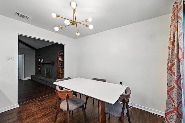 826 E Cherry St, Duncanville, TX 75116 - dining room featuring a chandelier, wood finished floors, a brick fireplace, and vaulted ceiling