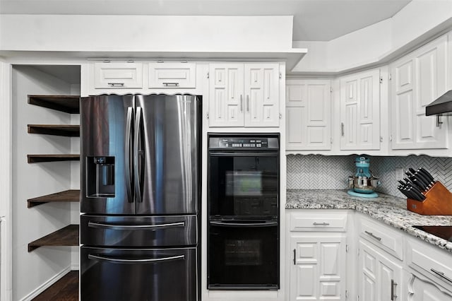 826 E Cherry St, Duncanville, TX 75116 - kitchen featuring stainless steel refrigerator with ice dispenser, white cabinetry, open shelves, tasteful backsplash, and light stone counters