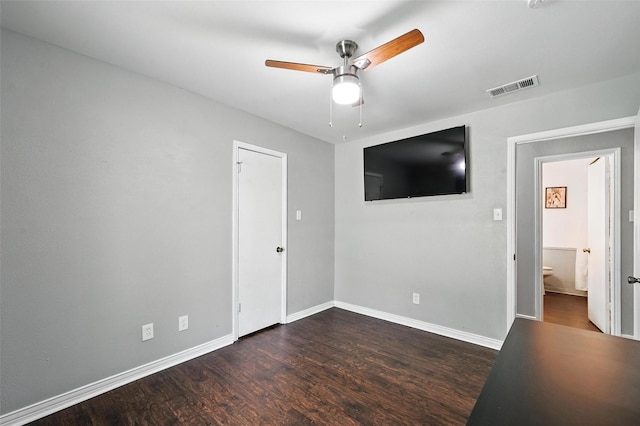 826 E Cherry St, Duncanville, TX 75116 - unfurnished bedroom featuring dark wood-type flooring and ceiling fan