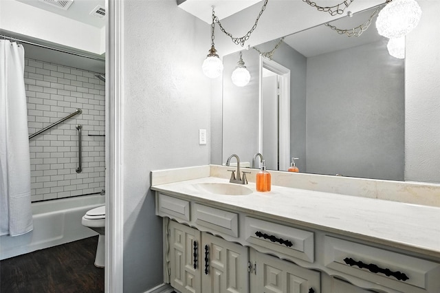 826 E Cherry St, Duncanville, TX 75116 - bathroom with vanity, wood finished floors, and shower / bath combo with shower curtain