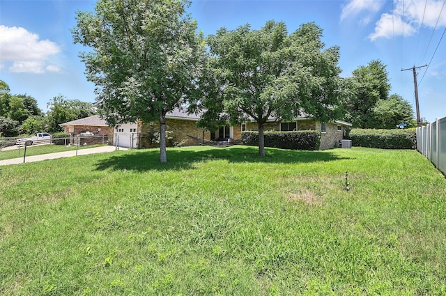 826 E Cherry St, Duncanville, TX 75116 - view of yard with driveway and a garage