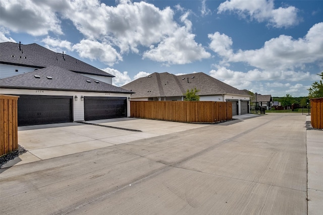 2128 Eastleigh Dr, Fort Worth, TX 76008 - view of side of home with driveway and a shingled roof