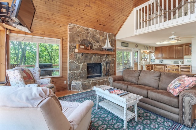 110 Waterview Ln, Pottsboro, TX 75076 - living area featuring high vaulted ceiling, wood finished floors, a fireplace, wood walls, and wooden ceiling