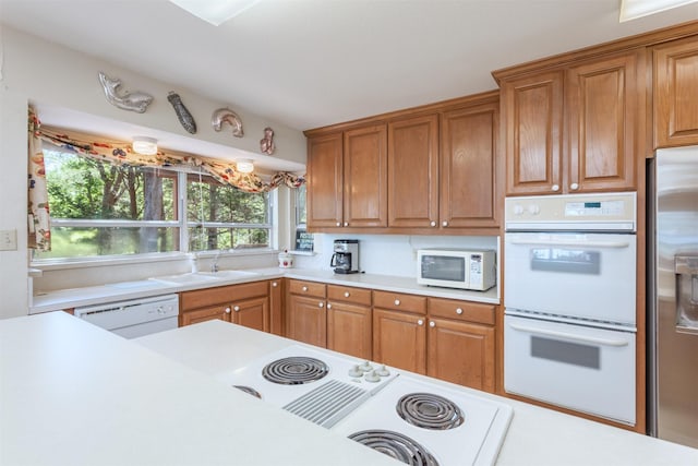 110 Waterview Ln, Pottsboro, TX 75076 - kitchen with white appliances, light countertops, and brown cabinets