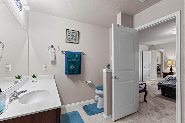 1420 Arabella Ave, Forney, TX 75126 - bathroom with a textured ceiling, vanity, and tile patterned floors