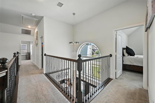 9840 El Colina Dr, Fort Worth, TX 76179 - hall with attic access, carpet floors, healthy amount of natural light, and an upstairs landing