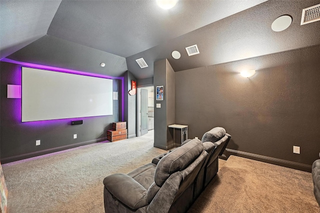 9840 El Colina Dr, Fort Worth, TX 76179 - carpeted home theater room featuring lofted ceiling and a textured ceiling