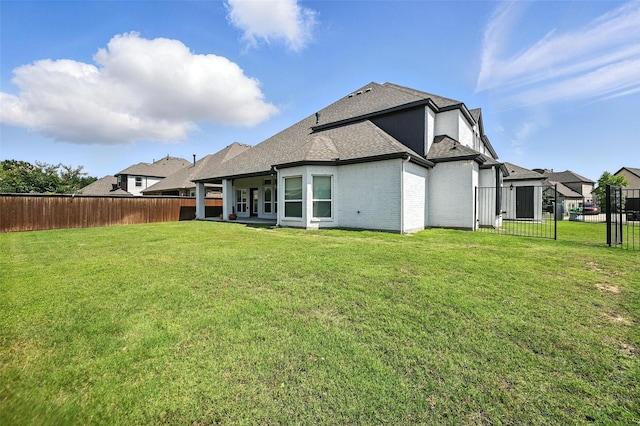 9840 El Colina Dr, Fort Worth, TX 76179 - back of property with roof with shingles, a fenced backyard, and brick siding