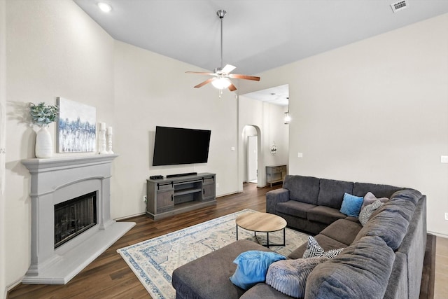 10200 Wildfowl Dr, Fort Worth, TX 76177 - living area with arched walkways, a glass covered fireplace, ceiling fan, dark wood-style flooring, and lofted ceiling
