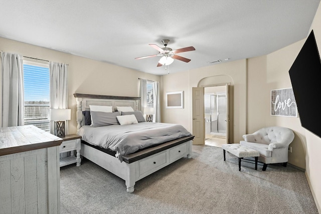 10200 Wildfowl Dr, Fort Worth, TX 76177 - bedroom featuring light carpet, multiple windows, a ceiling fan, and ensuite bath