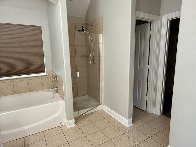 12713 Travers Trl, Fort Worth, TX 76244 - bathroom featuring a bath, tile patterned flooring, and a shower stall