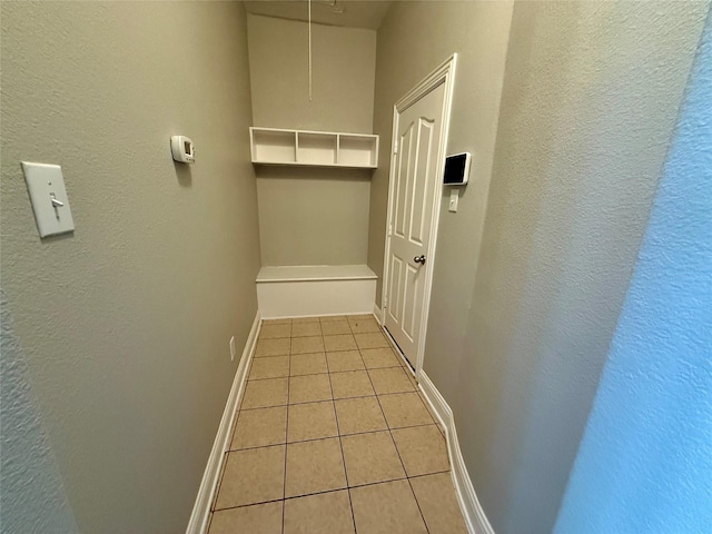 12713 Travers Trl, Fort Worth, TX 76244 - hall featuring light tile patterned flooring, attic access, and a textured wall