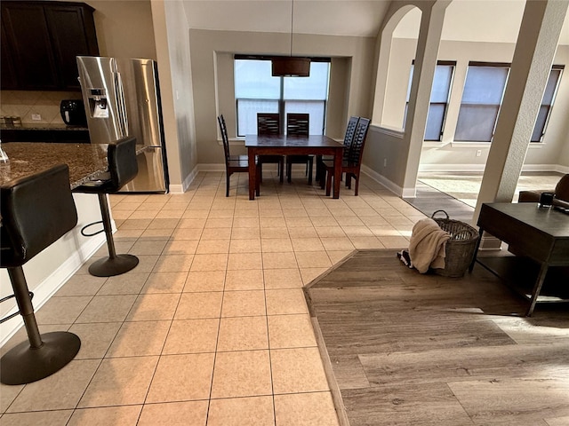 12713 Travers Trl, Fort Worth, TX 76244 - dining space featuring light tile patterned floors and arched walkways