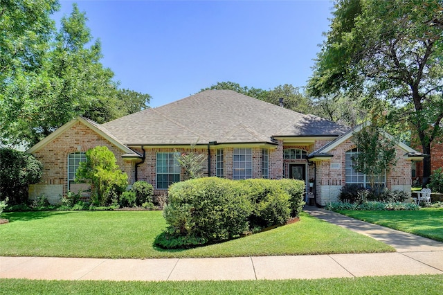 1660 Spinnaker Ln, Azle, TX 76020 - view of front of home featuring a front lawn, brick siding, and a shingled roof