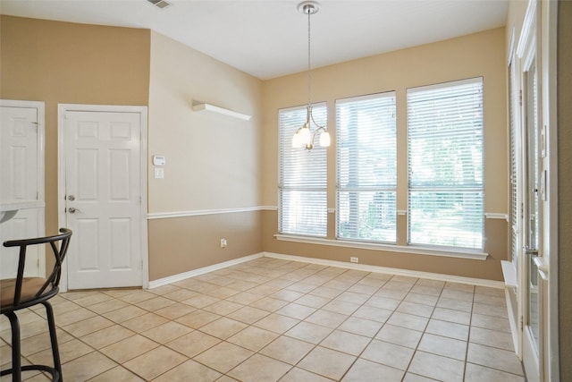 1660 Spinnaker Ln, Azle, TX 76020 - unfurnished dining area with a chandelier and light tile patterned floors