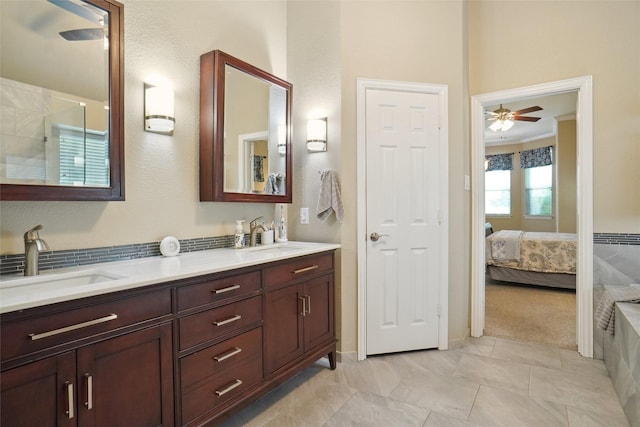 1660 Spinnaker Ln, Azle, TX 76020 - ensuite bathroom featuring double vanity, a ceiling fan, tile patterned floors, and tiled shower