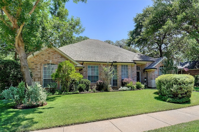 1660 Spinnaker Ln, Azle, TX 76020 - view of front of house with brick siding, a front lawn, and a shingled roof