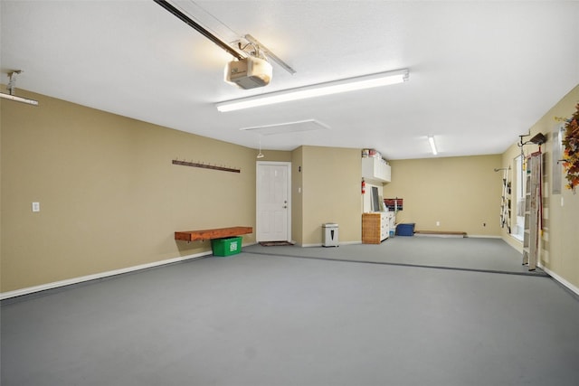 1660 Spinnaker Ln, Azle, TX 76020 - garage with a garage door opener and baseboards