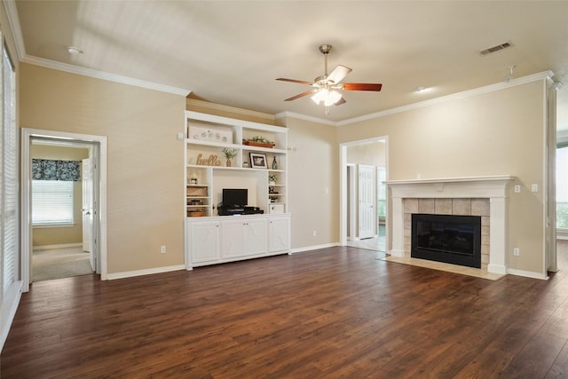 1660 Spinnaker Ln, Azle, TX 76020 - unfurnished living room with ceiling fan, dark wood-style floors, crown molding, and a tiled fireplace