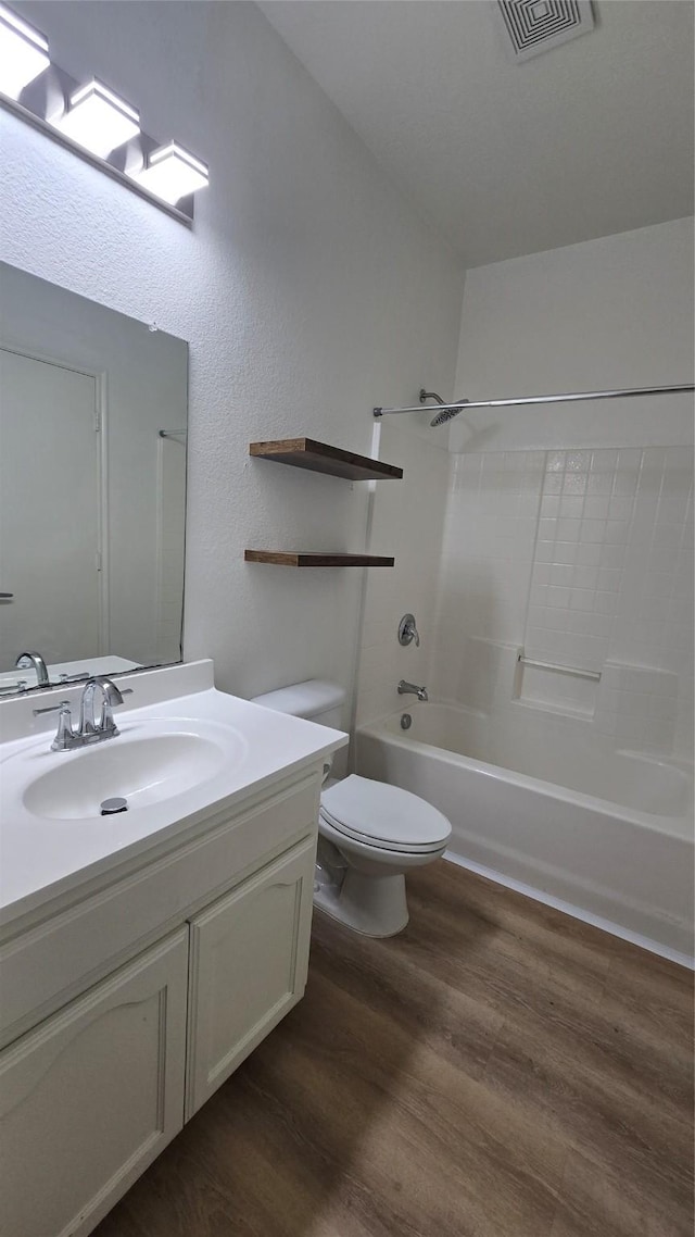 7448 Maroon Dr, Fort Worth, TX 76120 - bathroom with wood finished floors, vanity, and shower / bath combination