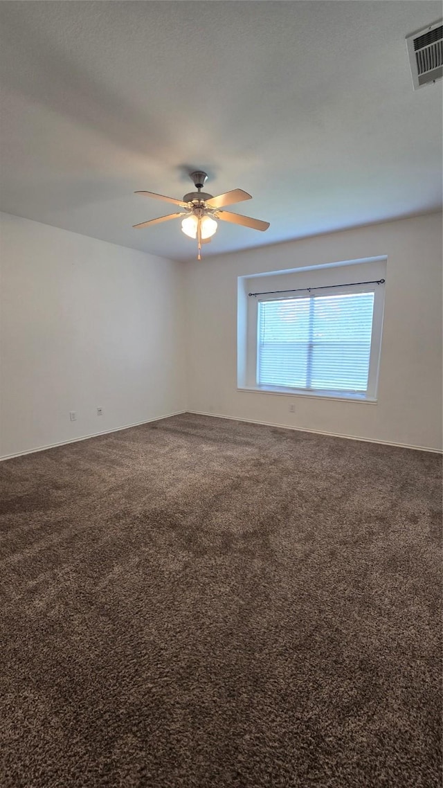 7448 Maroon Dr, Fort Worth, TX 76120 - carpeted empty room featuring ceiling fan