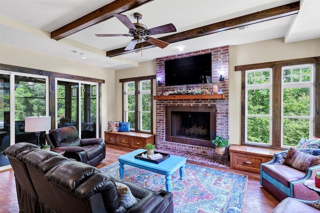 421 Dallas St, Argyle, TX 76226 - living area featuring beam ceiling, a fireplace, a ceiling fan, and wood finished floors