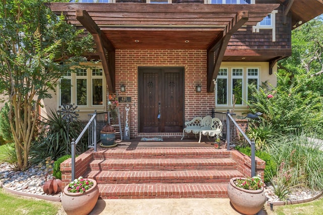 421 Dallas St, Argyle, TX 76226 - property entrance with brick siding, stucco siding, and a pergola