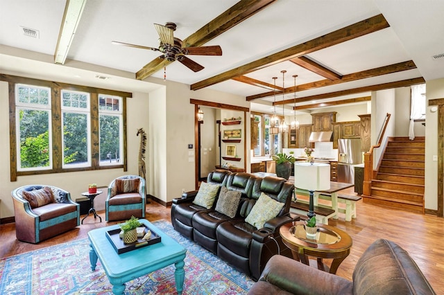 421 Dallas St, Argyle, TX 76226 - living area featuring light wood-style flooring, ceiling fan, beam ceiling, stairway, and a chandelier