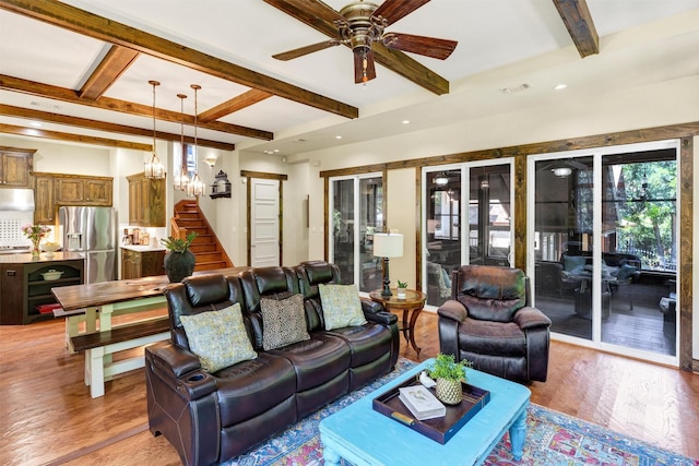 421 Dallas St, Argyle, TX 76226 - living area featuring beam ceiling, stairs, a ceiling fan, light wood-style flooring, and a chandelier