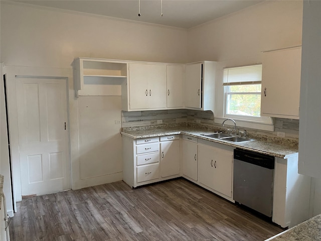 221 N Henderson St, Rusk, TX 75785 - kitchen featuring stainless steel dishwasher, white cabinetry, wood finished floors, ornamental molding, and light countertops