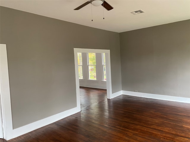 221 N Henderson St, Rusk, TX 75785 - unfurnished room with dark wood-type flooring and ceiling fan