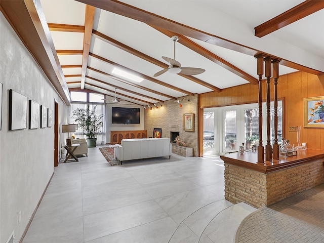 1102 N Graves St, Mckinney, TX 75069 - bedroom featuring multiple windows, wood walls, and a large fireplace