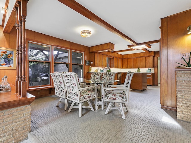 1102 N Graves St, Mckinney, TX 75069 - dining room featuring wooden walls and brick patterned floors