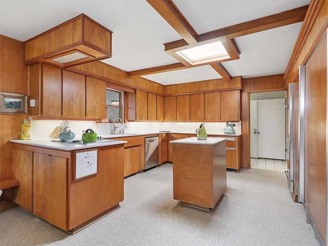 1102 N Graves St, Mckinney, TX 75069 - kitchen with stainless steel dishwasher, brown cabinets, a peninsula, wood walls, and light countertops